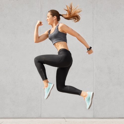active-woman-being-full-energy-jumps-high-air-wears-sportsclothes-prepares-sport-competitions-min
