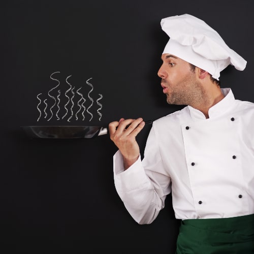 chef-blowing-smoke-from-pan-min