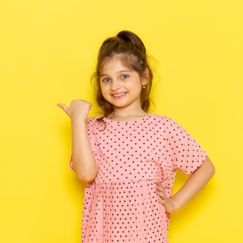 front-view-cute-little-kid-pink-dress-smiling-posing-min