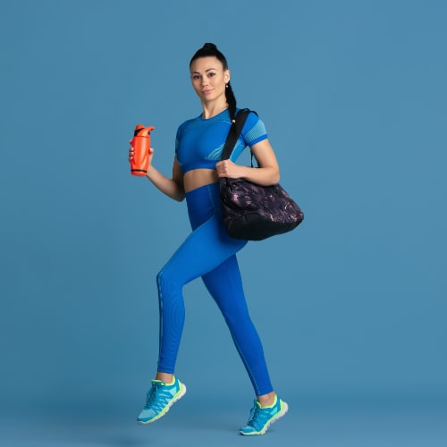 prepared-beautiful-young-female-athlete-practicing-monochrome-blue-portrait-sportive-fit-brunette-model-with-water-bottleand-bag-wellness-healthy-lifestyle-beauty-action-concept-min